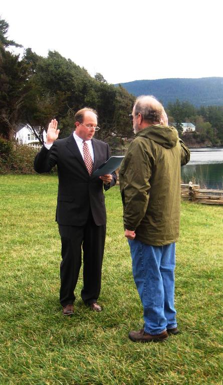 Rick Hughes is sworn in as County Council Member for Orcas West on Dec. 27 at the Eastsound Waterfront Park.