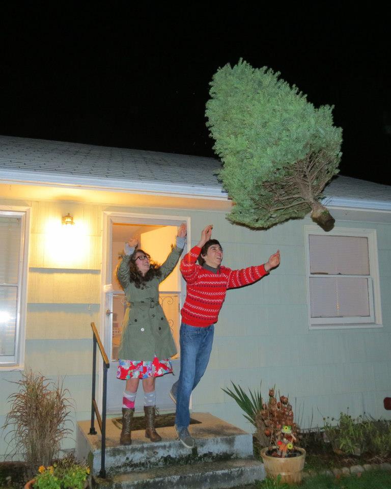 Tossing the Tree -- an old West Seattle tradition, dating back to 2010. Photo by permission only of Karen Lewis Carlos.