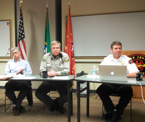 Dave Halloran, Sheriff Rob Nou and Orcas Fire and Rescue Chief Kevin O'Brien field questions from those gathered at the Town Hall to discuss the Marine Or UG