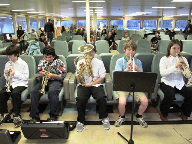 Making music, island-style, school horn players rehearse on the ferry