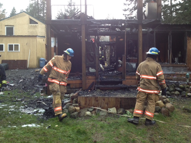 Orcas Fire and Rescue cleans up after fire in Sea Acres on March 18