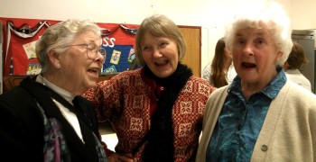 Joyce Burghardt, Patty Johnson, and Marilyn Anderson, who have played and sung with the Community Band, the Orcas Choral Society and the Music Advocacy Group for years, burst into song.