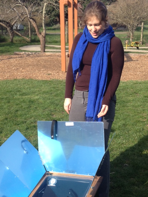 Emily Barrett of the Bonneville Environmental Foundation demonstrates the solar oven at Orcas Montessori