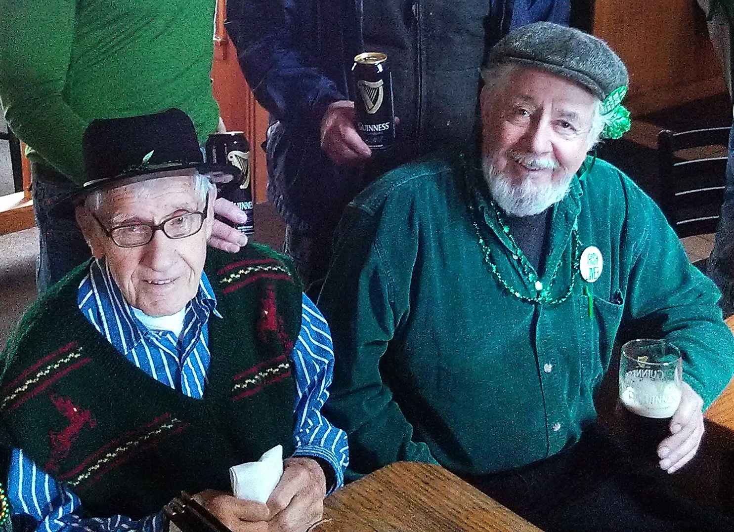 St. Patrick's Day Parade Grand Marshall Lou Milligan joins in song with Tony Lee at a raising of the glass ceremony following the parade on March 16.