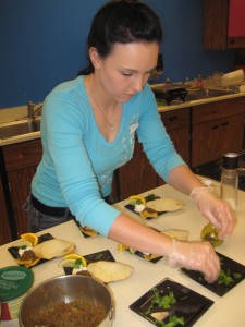 Caitlyn Holley puts the finishing touches on her delicious home made empenadas for the judges.