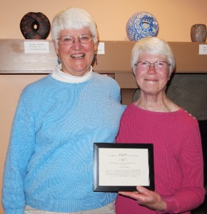 Molly Roberts (right) was honored as this year’s recipient of the Sky Award for volunteer service that builds and sustains community at OPAL Community Land Trust’s 23rd annual meeting. Presenting the award was Helen Bee, (left) OPAL trustee and past president of the board.