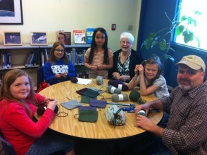 The Knitting Club members are each making numerous squares that will be joined together for a warm original blanket. Right to left: Greg White, Willow White, Alana Kelly, Uma McMurray, Sue Silvernail and Ingrid Hanson