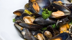 Mussels Mouclade is a traditional French dish of steamed mussels served in a lightly curried sauce