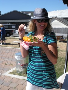 A happy market-goer enjoying local fare. Photo: Cara Russell