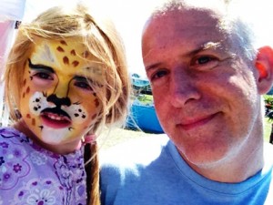 Political analyst Andrew Reynolds with his daughter Tess at Farmer’s Market. Tess is enrolled in the summer preschool program at Children’s House.