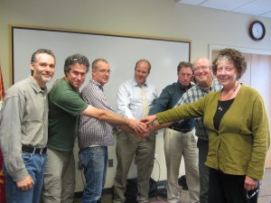 Smiles galore! From left, ORS Board members Mark DeTray, Michael Greenberg, Pete Moe, Council Members Rick Hughes, Jamie Stephens, Bob Jarman, and ORS Board member Susan Malins. Photo: Lin McNulty