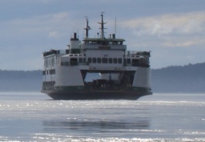 Caroline Buchanan has been crossing between Obstruction Island, her home, and Orcas since 1990, not always but often rowing her Whitehall -- a 17’ skiff built by Greg Thompson and Mike Stolmeier in 1990 at Obstruction Pass. Photo: Caroline Buchanan 