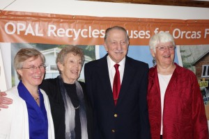 Jan and Frank Loudin (center) were named Lifetime Members of OPAL Community Land Trust for their long-time support during the annual gala dinner Saturday evening. Congratulating the Loudins are Lisa Byers, OPAL Executive Director (left), and Helen Bee, OPAL trustee (right). Also honored was Lifetime Member Sara Jane Johnson (not pictured).