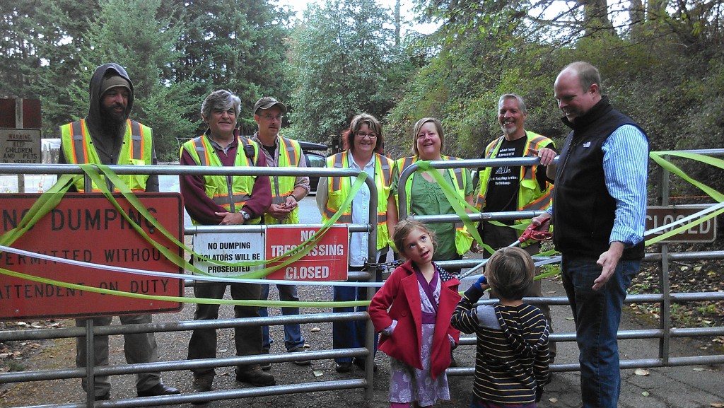 The Grand Opening of the Orcas Transfer Station -- the "Dump," From left, Gary Bauder, Pete Moe, Rhinna McGarry, Cheryl Jackson, Errol Speed, Rick Hughes, with Speed's grandchildren in front. Photo by Margie Doyle. 