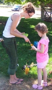 Chelsea shows a young garden enthusiast what flowers taste good in garden tea.