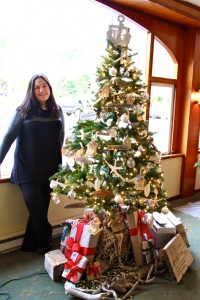 Veronica San Martin who decorated the coastal-themed tree for OPAL Community Land Trust.