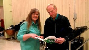 Karen Key Speck and Jim Shaffer-Bauck confer on music scores in preparation for their Dec. 14 annual concert.