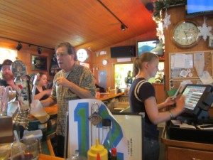 Bartenders Kyle and Vanessa, both Seahawks fans, were too busy to watch the game. Photo: Lin McNulty