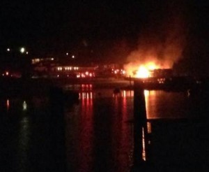 Flames visible from Deer Harbor Marina fire. Photo: Rob Kirby