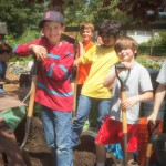 Countless pounds of dirt were moved by the kids to garden areas