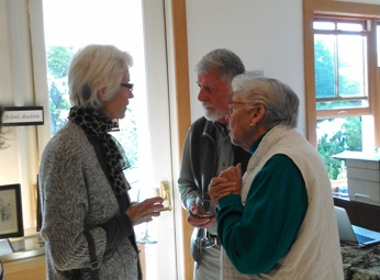 from right, Anne and Harlan Pedersen chat with Joyce Burghardt at the Emmanuel Parish Hall auction..