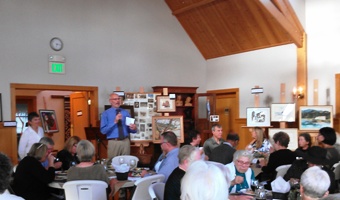 Lance Evans orchestrates the bidders for the auction of items from the Donohue, Gibson, Ferris and Koltun families of Orcas Island.