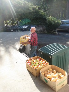 Rob Harlow, Black Dog Farm, delivers boxes of Garlic, beets, tomatoes, apples, peppers, basil and sweet onions to the school loading dock.