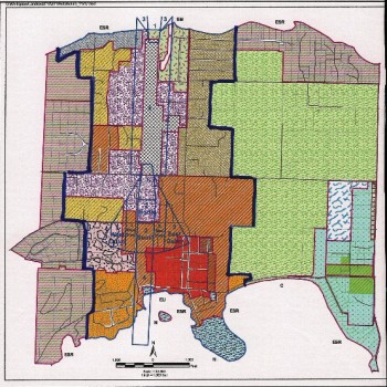 Eastsound Subarea, with Urban Growth Area (UGA) boundaries in dark blue.. The grey cross-hatch area in the center is the airport zone and the lavender-colored areas are Service Light Industrial zones. 