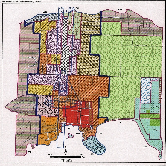 Corrected on Nov. 4 at 12:45 p.m. Eastsound zoning, 2014. The red outer lines define the Eastsound Sub-area. The bold dark blue lines define the Urban Growth Area (UGA),. The grey cross-hatch area in the center is the airport zone and the lavender-colored areas are Service Light Industrial zones. (County Community and Development Department document). For more detailed maps, see the comment following the article).