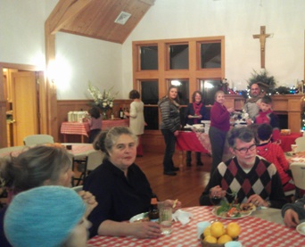 Emmanuel Episcopal Parish Hall bustles with its kids and families' pizza party.