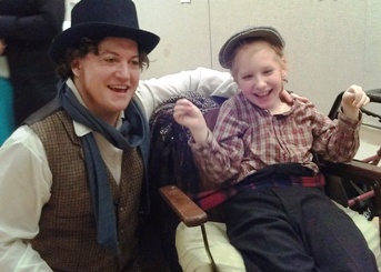 Christopher Evans and daughter Mona play Bob Cratchit and Tiny Tim