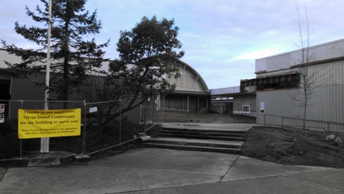 Construction as scheduled at the school: the Middle School will move into the former library on the left; the cafeteria building on the right will undergo construction for a remodeled kitchen, cafeteria and library; lunches (prepared at Camp Orkila) will be served in the old gym in the center.  