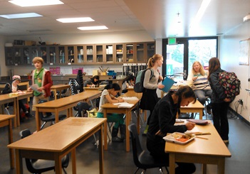 The middle school science classroom with shelves, storage and light to assist in learning