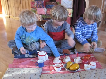 Three boys host a tea party at Salmonberry School