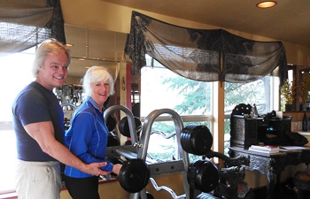 Stephen Forsyth and his partner Sukimah Hampton work with the barbells in his studio, The Art of Training.