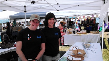 Kelsy Green and Linda Lyshall of the San Juans Conservation District greet visitors to the Oprcas Island  Energy Fair