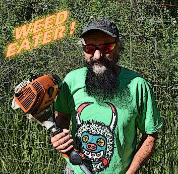 Jeff Bossler wearing his other hat, as landscaper and weed-eater