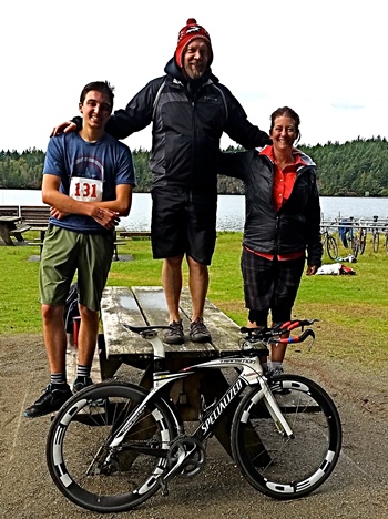 The Steve Braun Triathalon winning team takes the winners' podium, er picnic table. From left, Sean Maloney, James Buchanan, Beth Maloney 