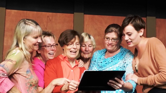 "Calendar Girls" Melinda Milligan, Suzanne Gropper, Lesley Liddle, Bev Leyman, Holly King and Sande proof the first the calendar that accompanies their play, "Calendar Girls" at the Grange