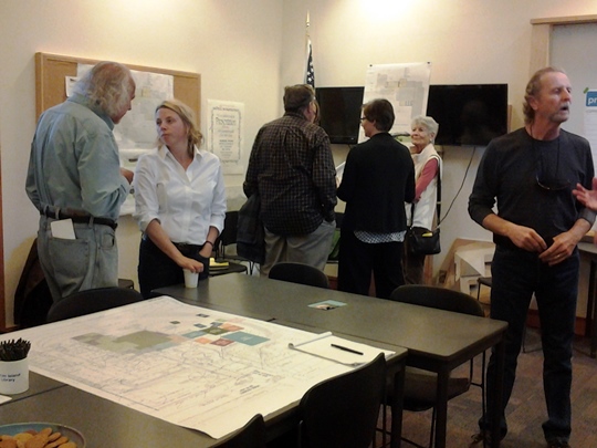 on the left, Liz LeRoy, Library Expansion Project Manager, discusses some of the details at the Library Open House on Sept. 22.