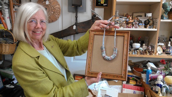 Kay Miller displays her Trashion Fashion jewelry creation. 