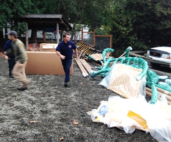 Fire and Rescue and others volunteer to unload a ton and a half of equipment!