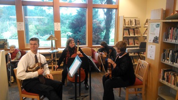 Tres Voci musicians Scott Heisinger, Holly King and Pamela Wright among the musicians entertaining at the Holiday Tea