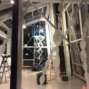 Atrium at San Juan Islands Museum of Art, as Dana Lyons installs "As Above, So Below"