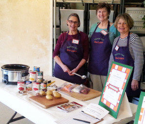 Madrona Club members (L-R) Marcia Spees, Louise Boone and Leith Templin taught Food Bank guests at the luncheon how to make “Island Stew” on March 1.