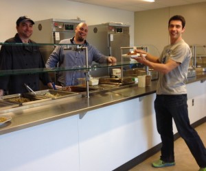 Chef Zach and Chef Madden serve lunch to high school student Pasha Bullock