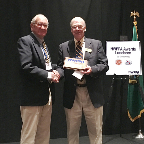 Retired OPALCO Board Member Bob Myhr receives the NWPPA Life Member award in Tulalip, WA.