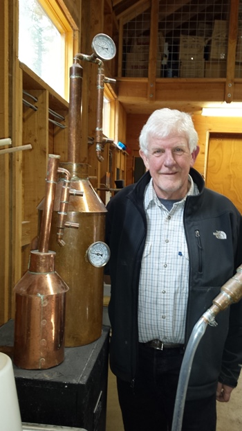 Charles West with his two copper stills