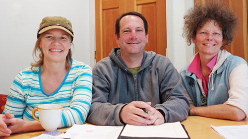 Rusty Diggs, Eros Belliveau and Carla Stanley, homeowners in OPAL’s Bonnie Brae and Wild Rose Meadow neighborhoods, met recently to share insights following their national advocacy on behalf of community land trusts and permanently affordable housing.