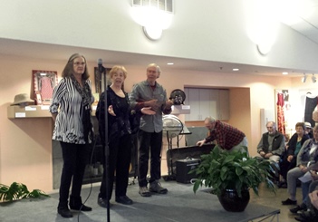 Tish Knapp, Marj Franke and Carl Burger serenade a packed house at the Senior Center